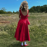 Robe longue plissée, évasée au dos et bas ample